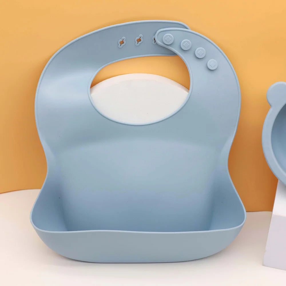 Babero de Silicona para Bebé con Bolsillo Recoge Alimentos Ajustable