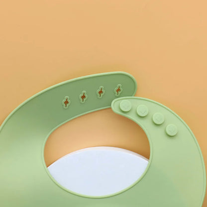 Babero de Silicona para Bebé con Bolsillo Recoge Alimentos Ajustable